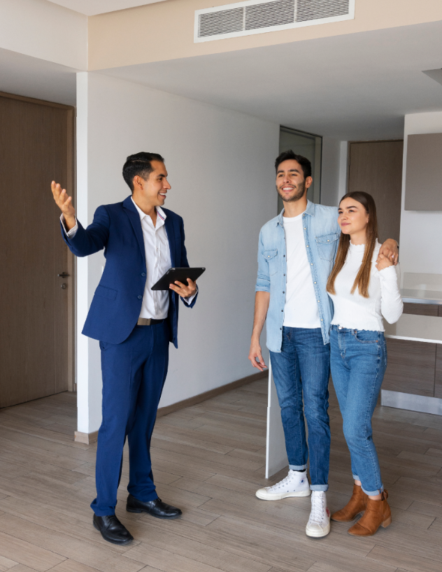 two people standing in a new home with one pointing at The Tupelo